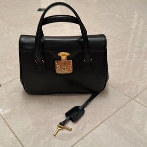Gucci satchel with gold lock and keys